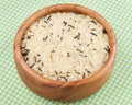 White and wild rice in wooden bowl Royalty Free Stock Photo