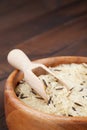 White and wild rice in wooden bowl on table Royalty Free Stock Photo