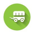 White Wild west covered wagon icon isolated with long shadow. Green circle button. Vector Royalty Free Stock Photo