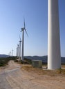 White wind turbines against the blue sky on the Greek island of Evia in Greece