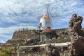 a white windmill as a symbol of the cactus garden in lanzarote