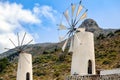 White windmills at sapiens museum in Lassithi district on Crete island, Greece Royalty Free Stock Photo