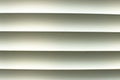 The white window blinds that shine through from the outside. Royalty Free Stock Photo