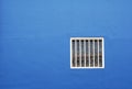 White window, blue wall background Royalty Free Stock Photo