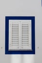 White Window Shutters with blue border Royalty Free Stock Photo
