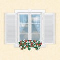 White window with shutters and flowers