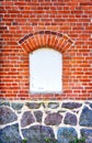 White window with space for text on a brick and natural stone wall Royalty Free Stock Photo