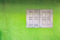 White windows on the green wall Royalty Free Stock Photo