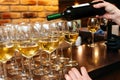 White wine being poured into glasses Royalty Free Stock Photo