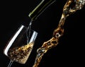 White wine being poured into wineglass Royalty Free Stock Photo