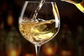 a White wine being poured in the wineglass Royalty Free Stock Photo