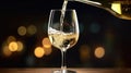 a White wine being poured in the wineglass Royalty Free Stock Photo