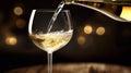 a White wine being poured in the wineglass Royalty Free Stock Photo