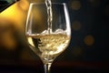 a White wine being poured in the wineglass Royalty Free Stock Photo