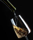 White wine being poured into wineglass Royalty Free Stock Photo