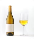 White wine bottle with blank label and wine goble