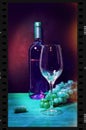 White wine bottle in strip film frame with glass and bunch of grapes on the wooden table Royalty Free Stock Photo