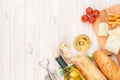 White wine, cheese and bread on white wooden table background Royalty Free Stock Photo