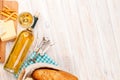 White wine, cheese and bread on white wooden table background Royalty Free Stock Photo