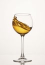 White wine diagonal wave, curl is in stemmed glass.