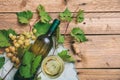 White wine glass and bottle and fresh grapes on wooden background, copy space Royalty Free Stock Photo