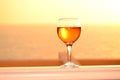 White wine glass on a sunset background Royalty Free Stock Photo