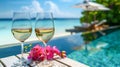 White wine in glasses with the pool and sandy beach on the background - AI Generated Royalty Free Stock Photo