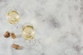 White wine on light background. Two wineglasses of vino verde. Seasonal holidays concept Royalty Free Stock Photo