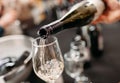 White wine pouring from a bottle into a glass. Soft focus Royalty Free Stock Photo