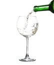 White wine pouring from the bottle intro the glass Royalty Free Stock Photo