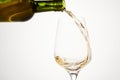 White wine pouring from green bottle, close up. Royalty Free Stock Photo