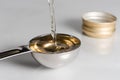 Pouring White Wine Vinegar into a Teaspoon Royalty Free Stock Photo