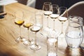 White wines in glasses on table, sommelier tasting preparation. White wines in glasses on table, sommelier tasting