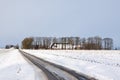 White winter landscape of field with farm Royalty Free Stock Photo
