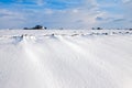 White winter landscape of field with farm Royalty Free Stock Photo