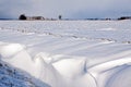 White winter landscape of field with farm Royalty Free Stock Photo