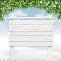 White winter wooden signboard in snow