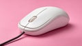 White wired computer mouse on a pink background. Royalty Free Stock Photo