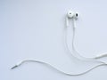 White wired headphones, headset on a white background.