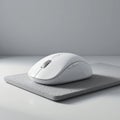 White Wireless Computer Mouse on Grey Mouse Pad Royalty Free Stock Photo