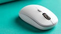 White wireless computer mouse on a teal background, modern design Royalty Free Stock Photo