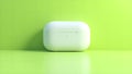 White wireless earbud case on lime green. Royalty Free Stock Photo
