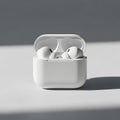 White wireless earbuds in charging case Royalty Free Stock Photo