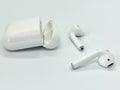 White Wireless Earbuds Out of Opened Case