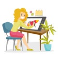 A white woman graphic designer works at the office desk. Royalty Free Stock Photo