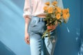 woman yellow white romantic sweater green blue floral bouquet flower hand. Generative AI. Royalty Free Stock Photo