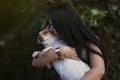 White woman playing with her dog pet