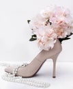 1, white women's stiletto Shoe, pearl, necklace, flower, hydrangea Royalty Free Stock Photo
