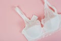 White women underwear with lace on pink background. whitebra and pantie.Copy space. Beauty, fashion blogger concept. Romantic