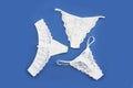 White womens lace panties on blue background